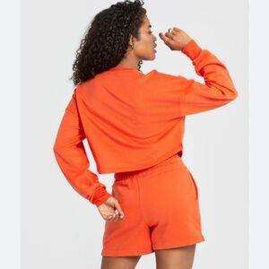 Women’s Best size large orange cropped sweatshirt.